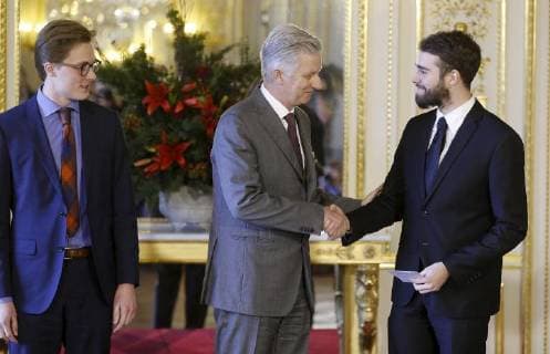 Ruben Matthys, King Philippe - Filip of Belgium and Milan Berckmans pictured during the award ceremony of Belgodyssee at Royal Palace, Thursday 14 December 2017 in Brussels.  NICOLASxMAETERLINCK 05218701