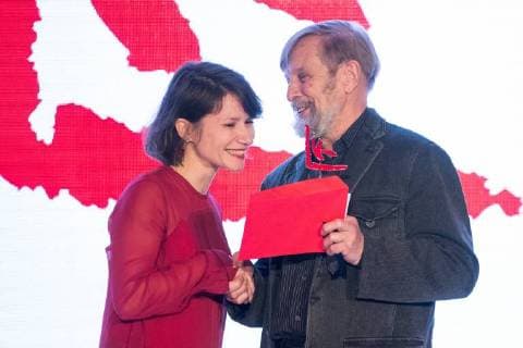 MOSCOW, RUSSIA - DECEMBER 15, 2017: Sasha Pirogova (entry MONO ), left, winner of the 11th Kandinsky Prize in the Young Artist: Project of the Year category, receives her award from writer Boris Orlov at the 11th Kandinsky Prize ceremony at the Udarnik Cinema. Sergei Bobylev TASS  TS06D531