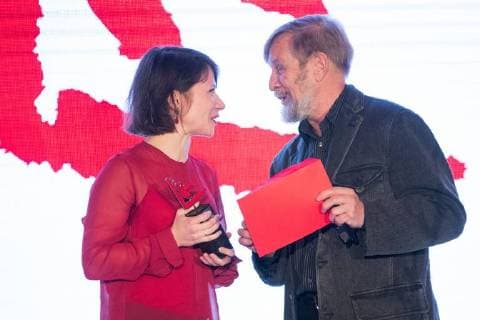 MOSCOW, RUSSIA - DECEMBER 15, 2017: Sasha Pirogova (entry MONO ), left, winner of the 11th Kandinsky Prize in the Young Artist: Project of the Year category, receives her award from writer Boris Orlov at the 11th Kandinsky Prize ceremony at the Udarnik Cinema. Sergei Bobylev TASS  TS06D53A