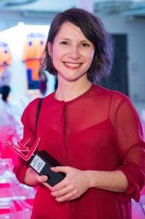MOSCOW, RUSSIA - DECEMBER 15, 2017: Sasha Pirogova (entry MONO ), left, winner of the 11th Kandinsky Prize in the Young Artist: Project of the Year category, is pictured with her award at the 11th Kandinsky Prize ceremony at the Udarnik Cinema. Sergei Bobylev TASS  TS06D566