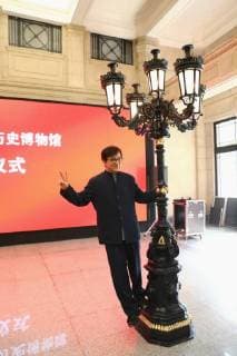 Hong Kong kungfu star Jackie Chan poses for photos with one of the six replicas during a ceremony to mark his donation of an antique street lamp and six replicas to the Shanghai History Museum in Shanghai, China, 17 December 2017. Jackie Chan on Sunday (17 December 2017) donated an antique street lamp and six replicas to the Shanghai History Museum. The 63-year-old film actor posed for pictures with one of the replicas during a ceremony at the museum at 325 Nanjing Road W. The original lamp is undergoing restoration, the museum said. Chan, a keen antiques collector outside his movie career, said he spotted a number of ornate street lamps on sale while filming in the United States many years ago. The Taiwan couple selling them said they were from Shanghai during the Republic of China (1912-1949) period. He bought 19 lamps from the coupl  pbu726482_02