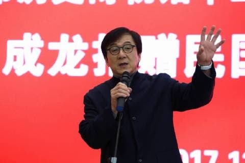 Hong Kong kungfu star Jackie Chan attends a ceremony to mark his donation of an antique street lamp and six replicas to the Shanghai History Museum in Shanghai, China, 17 December 2017. Jackie Chan on Sunday (17 December 2017) donated an antique street lamp and six replicas to the Shanghai History Museum. The 63-year-old film actor posed for pictures with one of the replicas during a ceremony at the museum at 325 Nanjing Road W. The original lamp is undergoing restoration, the museum said. Chan, a keen antiques collector outside his movie career, said he spotted a number of ornate street lamps on sale while filming in the United States many years ago. The Taiwan couple selling them said they were from Shanghai during the Republic of China (1912-1949) period. He bought 19 lamps from the couple at up to US$4,500 each and had them shipped  pbu726482_05
