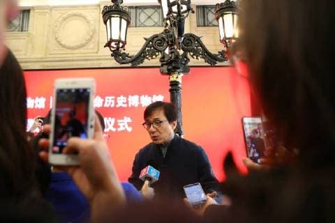 Hong Kong kungfu star Jackie Chan attends a ceremony to mark his donation of an antique street lamp and six replicas to the Shanghai History Museum in Shanghai, China, 17 December 2017. Jackie Chan on Sunday (17 December 2017) donated an antique street lamp and six replicas to the Shanghai History Museum. The 63-year-old film actor posed for pictures with one of the replicas during a ceremony at the museum at 325 Nanjing Road W. The original lamp is undergoing restoration, the museum said. Chan, a keen antiques collector outside his movie career, said he spotted a number of ornate street lamps on sale while filming in the United States many years ago. The Taiwan couple selling them said they were from Shanghai during the Republic of China (1912-1949) period. He bought 19 lamps from the couple at up to US$4,500 each and had them shipped  pbu726482_09