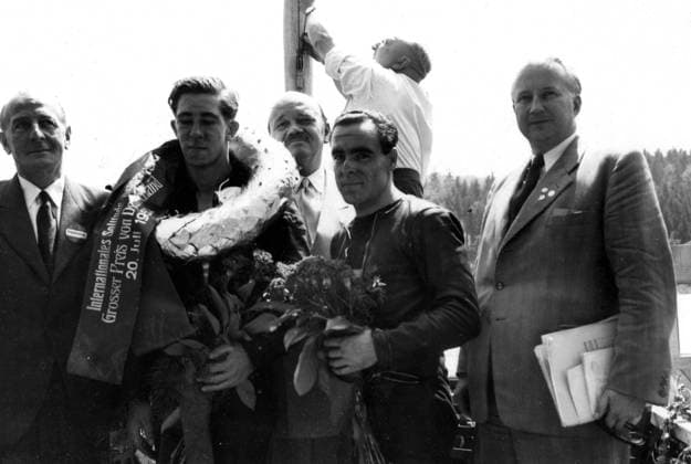 Ireland s Reginald Armstrong with the laurels after winning the 350cc event during the international motorcycle meet on the Solitude mountainside course near Stuttgart , Germany . Also in the picture are left to right Joe Craig , chief of the British Norton team ; Ken Kavanagh , Australia , who was placed second in the 350 event and West German Minister of Transport and Traffic , Hans-Christoph Seebohm . 22 July 1952, Germany Copyright: Topfoto  !ACHTUNG AUFNAHMEDATUM GESCHÄTZT! UnitedArchives1345349