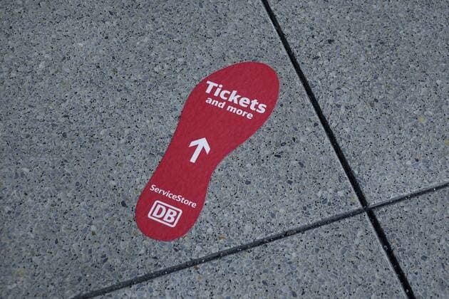 07 12 2017 Schöneberg Berlin Südkreuz station footprint at Südkreuz signpost direction arrow tickets Tickets Bahn DB Deutsche Bahn ServiceStore service store business shop ticket office shoe impression footprint station Southern Cross