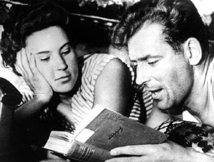 Major Gherman Stepanovich Titov, the second Soviet astronaut launched into space aboard Vostok II with Madame Tamara Titov his wife , reading a book at their home. 7 August 1961, Moscow Russia Federation Copyright: Topfoto  !ACHTUNG AUFNAHMEDATUM GESCHÄTZT! UnitedArchives1356703