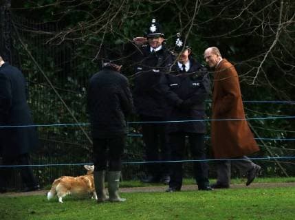 Prince Philip, Duke of Edinburgh, looks at a person with a corgi dog as he leaves the St. Mary Magdalene Church Sunday morning service, on Christmas Eve, in Sandringham, Norfolk, on December 24, 2017. 