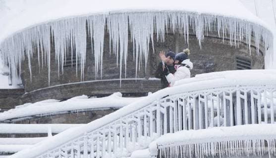 (171230) -- ONTARIO, Dec. 30, 2017 -- Visitors take photos with an ice and snow covered building at Niagara Falls in Ontario, Canada, on Dec. 30, 2017. Canada experienced extreme cold weather recently. ) CANADA-ONTARIO-EXTREME COLD WEATHER ZouxZheng 