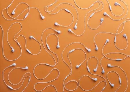 White earphones on orange background, 3D Rendering  DRBF00031