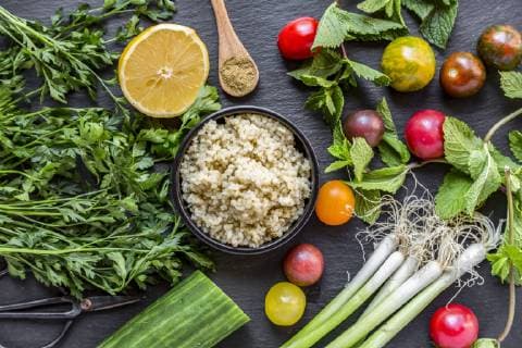 Bowl of Bulgur and ingredients for preparing Tabbouleh  SARF03386