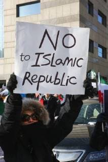 January 6, 2018 - Toronto, Ontario, Canada - Protestor holds a sign saying No to Islamic Republic as hundreds of Canadians take part in a protest against the Islamic Republic of Iran in Toronto, Ontario, Canada, on January 06, 2018. Protestors showed their solidarity with anti-government demonstrators in Iran and their support of a national uprising of the Iranian people. Protesters called for a regime change for social justice and freedom and democracy in Iran. There was a also a call that power in Iran be returned to Reza Pahlavi, the former Crown Prince of Iran and the last heir apparent to the defunct throne of the Imperial State of Iran and the current head of the exiled House of Pahlavi. Toronto Canada  - ZUMAn230 20180106_zaa_n230_1124 Copyright: xCreativexTouchxImagingxLtdx
