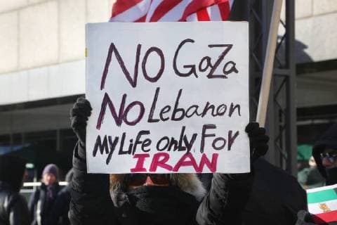 January 6, 2018 - Toronto, Ontario, Canada - Protestor holds a sign saying No to Gaza, No to Lebanon, My Life Only for Iran as hundreds of Canadians take part in a protest against the Islamic Republic of Iran in Toronto, Ontario, Canada, on January 06, 2018. Protestors showed their solidarity with anti-government demonstrators in Iran and their support of a national uprising of the Iranian people. Protesters called for a regime change for social justice and freedom and democracy in Iran. There was a also a call that power in Iran be returned to Reza Pahlavi, the former Crown Prince of Iran and the last heir apparent to the defunct throne of the Imperial State of Iran and the current head of the exiled House of Pahlavi. Toronto Canada - ZUMAn230 20180106_zaa_n230_1128 Copyright: xCreativexTouchxImagingxLtdx