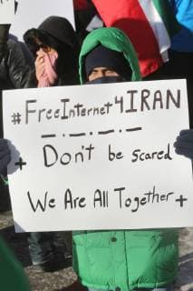 January 6, 2018 - Toronto, Ontario, Canada - Protestor holds a sign saying Free Internet for Iran as hundreds of Canadians take part in a protest against the Islamic Republic of Iran in Toronto, Ontario, Canada, on January 06, 2018. Protestors showed their solidarity with anti-government demonstrators in Iran and their support of a national uprising of the Iranian people. Protesters called for a regime change for social justice and freedom and democracy in Iran. There was a also a call that power in Iran be returned to Reza Pahlavi, the former Crown Prince of Iran and the last heir apparent to the defunct throne of the Imperial State of Iran and the current head of the exiled House of Pahlavi. Toronto Canada  - ZUMAn230 20180106_zaa_n230_1139 Copyright: xCreativexTouchxImagingxLtdx
