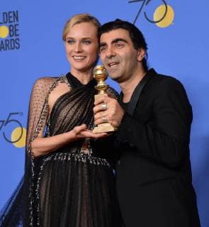 Themen der Woche Bilder des Tages Actor Diane Kruger (L) and director Fatih Akin appear backstage after winning the award for Best Motion Picture - Foreign Language for In The Fade during the 75th annual Golden Globe Awards at the Beverly Hilton Hotel in Beverly Hills, California on January 7, 2018.  LAP20180107578 JIMxRUYMEN
