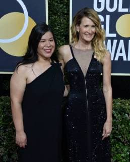 Actor Laura Dern (R) and activist Monica Ramirez attend the 75th annual Golden Globe Awards at the Beverly Hilton Hotel in Beverly Hills, California on January 7, 2018.  LAP20180107715 JIMxRUYMEN