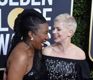 Activist Tarana Burke and actor Michelle Williams attend the 75th annual Golden Globe Awards at the Beverly Hilton Hotel in Beverly Hills, California on January 7, 2018.  LAP20180107844 JIMxRUYMEN