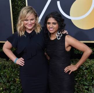Actor Amy Poehler and activist Saru Jayaraman attend the 75th annual Golden Globe Awards at the Beverly Hilton Hotel in Beverly Hills, California on January 7, 2018.  LAP20180107892 JIMxRUYMEN