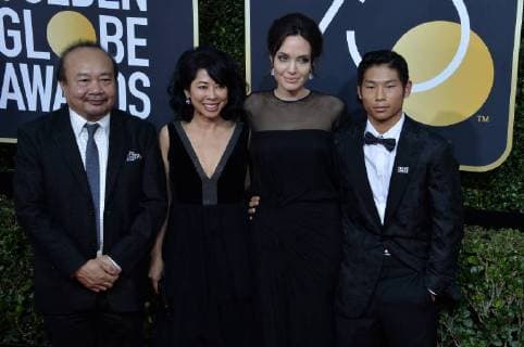 Filmmaker Rithy Panh, activist Loung Ung, actor director Angelina Jolie and Pax Thien Jolie-Pitt attend the 75th annual Golden Globe Awards at the Beverly Hilton Hotel in Beverly Hills, California on January 7, 2018.  LAP20180107928 JIMxRUYMEN