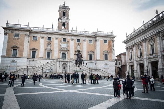 Tourists in the streets of Rome ROME, ITALY - JANUARY 04, Tourists around the historic center of Rome, tourists in Piazza del Campidoglio on January 04, 2018 in Rome, Italy. Rome Italy Italy  AndreaxRonchini