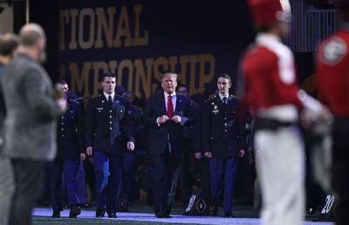 President Donald Trump arrives for the National Anthem before the first half of the NCAA College Football Playoff National Championship at Mercedes-Benz Stadium on January 8, 2018 in Atlanta.  CFP20180108320 DAVIDxTULIS
