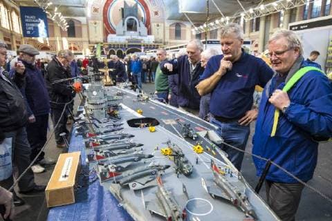January 19, 2018 - London, London, UK - London, UK. Dave Fortey (2-R) talks with a visitor about his model of HMS Ark Royal (R09) at the London Model Engineering Exhibition at Alexandra Palace. Fortey, a former Royal Navy mechanic and sub-lieutenant, built the model over 25 years. It is the first time it has been put on display to the public. London UK  - ZUMAl94_ 20180119_zaf_l94_017 Copyright: xRobxPinneyx