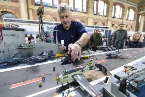 January 19, 2018 - London, London, UK - London, UK. Dave Fortey arranges a helicopter on the deck of his model of HMS Ark Royal (R09) at the London Model Engineering Exhibition at Alexandra Palace. Fortey, a former Royal Navy mechanic and sub-lieutenant, built the model over 25 years. It is the first time it has been put on display to the public. London UK  - ZUMAl94_ 20180119_zaf_l94_029 Copyright: xRobxPinneyx
