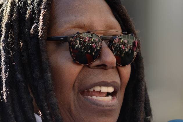 Protesters carry signs at the Women s March on January 20, 2018 in New York City. Whoopi Goldberg New York United States  569937