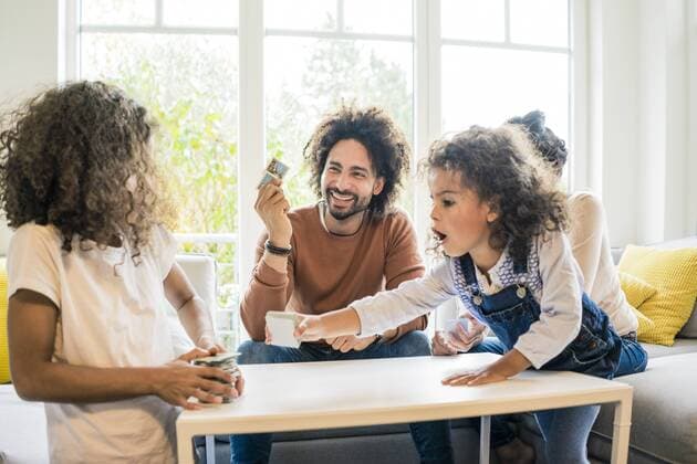 Family sitting on couch , playing memory game model released Symbolfoto property released  MOEF00394