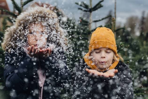 Brother and sister having fun with snow before Christmas model released Symbolfoto  MJF02233