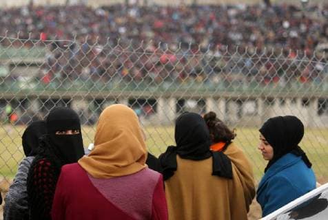 January 28, 2018 - Nuseirat, Gaza Strip, Palestinian Territory - Palestinian women watch the football match between Al-Nuseirat and Al-Jalaa standing outside the fence of the stadium, at Nuseirat refugee camp, in the central of Gaza Strip, on January 28, 2018. Palestinian police allowed women to attending the football match on the first time in Gaza Strip Nuseirat Palestinian Territory - ZUMAap3_ 20180128_zaf_ap3_162 Copyright: xAshrafxAmrax