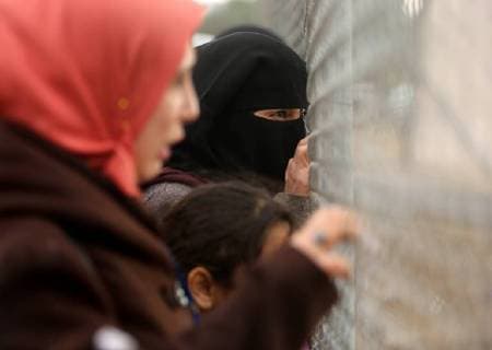 January 28, 2018 - Nuseirat, Gaza Strip, Palestinian Territory - Palestinian women watch the football match between Al-Nuseirat and Al-Jalaa standing outside the fence of the stadium, at Nuseirat refugee camp, in the central of Gaza Strip, on January 28, 2018. Palestinian police allowed women to attending the football match on the first time in Gaza Strip Nuseirat Palestinian Territory - ZUMAap3_ 20180128_zaf_ap3_172 Copyright: xAshrafxAmrax