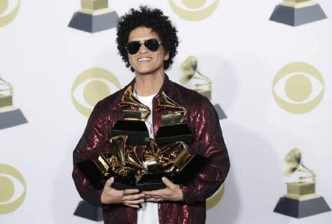 Bruno Mars arrives in the press room with his six Grammy Awards at the 60th Annual Grammy Awards ceremony at Madison Square Garden in New York City on January 28, 2018. The CBS network will broadcast the show live from Madison Square Garden in New York City. It will be the first time since 2003 that the ceremony will not be held in Los Angeles.  NYP20180128868 JOHNxANGELILLO