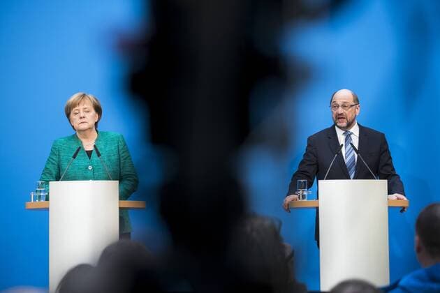 Angela Merkel and Martin Schulz during a press conference on the announcement of the compromise reached in the coalition agreement in the CDU federal party headquarters of Konrad Adenauer House in Berlin on 7 February 2018 coalition talks in Berlin