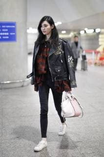 Chinese model Xi Mengyao, better known as Ming Xi, is pictured at the Beijing Capital International Airport in Beijing, China, 8 February 2018. Ming Xi flashes slim figure in casual wear at Beijing airport  pbu752495_22