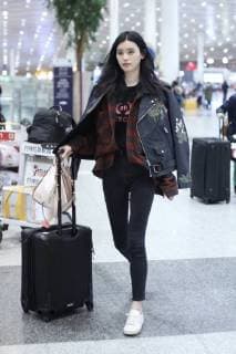 Chinese model Xi Mengyao, better known as Ming Xi, is pictured at the Beijing Capital International Airport in Beijing, China, 8 February 2018. Ming Xi flashes slim figure in casual wear at Beijing airport  20180208_10427