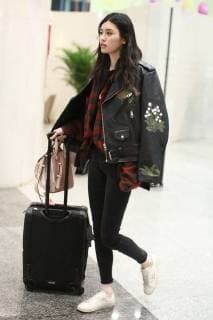Chinese model Xi Mengyao, better known as Ming Xi, is pictured at the Beijing Capital International Airport in Beijing, China, 8 February 2018. Ming Xi flashes slim figure in casual wear at Beijing airport  20180208_33068