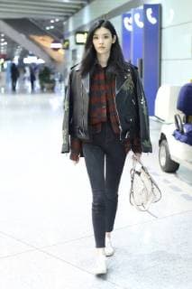 February 8, 2018 - Beijing, Beijing, China - Beijing,CHINA-8th February 2018: Chinese model Ming Xi shows at the airport in Beijing. Ming Xi or Xi Mengyao is a Chinese fashion model. Her professional modeling career started in 2009 after she attended a TV competition. Her international modeling career took off in 2011 after she walked her first well-known runway debut for Givenchy Haute Spring Show. In the same year, Ming Xi modeled the Givenchy ready-to-wear collection and appeared as the face of GivenchyÃ¢â‚¬â ¢s FallWinter publicity advertising campaign. Ming Xi also modeled for Victoria s Secret Fashion Shows in 2013, 2014, 2015, 2016 and 2017. She was named as a top supermodel of the world, and she is an in-demand model. Beijing China  - ZUMAs145 20180208_zaa_s145_171 Copyright: xSIPAxAsiax