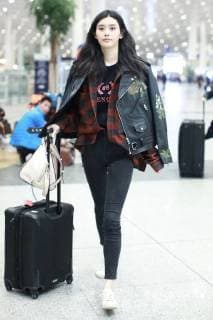 February 8, 2018 - Beijing, Beijing, China - Beijing,CHINA-8th February 2018: Chinese model Ming Xi shows at the airport in Beijing. Ming Xi or Xi Mengyao is a Chinese fashion model. Her professional modeling career started in 2009 after she attended a TV competition. Her international modeling career took off in 2011 after she walked her first well-known runway debut for Givenchy Haute Spring Show. In the same year, Ming Xi modeled the Givenchy ready-to-wear collection and appeared as the face of GivenchyÃ¢â‚¬â ¢s FallWinter publicity advertising campaign. Ming Xi also modeled for Victoria s Secret Fashion Shows in 2013, 2014, 2015, 2016 and 2017. She was named as a top supermodel of the world, and she is an in-demand model. Beijing China  - ZUMAs145 20180208_zaa_s145_176 Copyright: xSIPAxAsiax