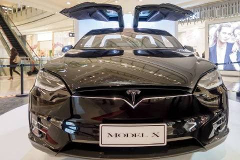China: A glimpse of Tesla Model X A black Tesla Model X shows at a shopping mall in Shanghai, March 9th, 2017. The Tesla Model X is a full-sized, all-electric, luxury, crossover SUV made by Tesla Inc. that uses falcon wing doors for access to the second and third row seats. CHINA OUT Shanghai Shanghai China  WangxGang