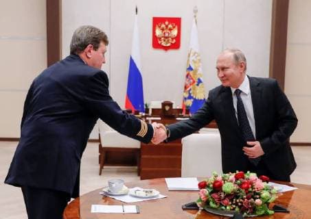 MOSCOW REGION, RUSSIA â€“ FEBRUARY 14, 2018: Russia s President Vladimir Putin (R) shakes hands with Nikolai Izosimov, head of Aeroflot s flight training division in Moscow and winner of the Mentor of the Year award at the 2018 Mentor All-Russia Forum, during a meeting at Novo-Ogaryovo residence. Mikhail Metzel TASS  TS073D08