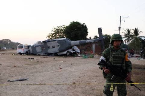 (180217) -- OAXACA (MOXICO), Feb. 17, 2018 -- A soldier stands guard at the helicopter accident site in Santiago Jamiltepec of Oaxaca, Mexico, on Feb. 17, 2018. Thirteen people were killed after a military helicopter crashed on Friday in southern Mexico following an earthquake in the region, prosecutors in Oaxaca State said Saturday. The helicopter also carried Mexican Interior Minister Alfonso Navarrete and Governor of Oaxaca State Alejandro Murat, both of whom survived. ) (jg)(rtg) MEXICO-OAXACA-HELICOPTER-CRASH RebecaxMartinez 