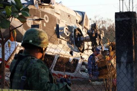 (180217) -- OAXACA (MOXICO), Feb. 17, 2018 -- Soldiers inspect the helicopter accident site in Santiago Jamiltepec of Oaxaca, Mexico, on Feb. 17, 2018. Thirteen people were killed after a military helicopter crashed on Friday in southern Mexico following an earthquake in the region, prosecutors in Oaxaca State said Saturday. The helicopter also carried Mexican Interior Minister Alfonso Navarrete and Governor of Oaxaca State Alejandro Murat, both of whom survived. ) (jg)(rtg) MEXICO-OAXACA-HELICOPTER-CRASH RebecaxMartinez 
