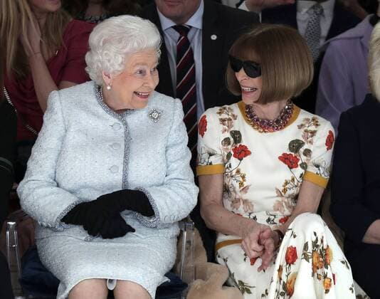 February 20, 2018 - London, GREAT BRITAIN - Britain s Queen Elizabeth sits next to fashion editor Anna Wintour as they view Richard Quinn s runway show before presenting him with the inaugural Queen Elizabeth II Award for British Design, as she visits London Fashion Week s BFC Show Space in central London, Tuesday, February 20, 2018. London GREAT BRITAIN - ZUMAp124 20180220_zaa_p124_008 Copyright: xYuixMok Poolx