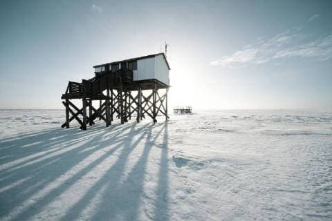 Pile dwelling in winter at the snow-covered beach Sankt Peter Ording Schleswig Holstein Germany Europe Copyright: imageBROKER/RalfxWilken ibxrwi04640028.jpg