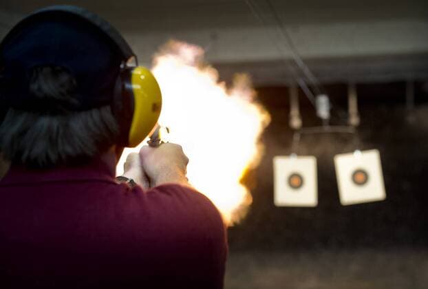 July 19, 2013 - Robbinsdale, Minnesota, USA - Peter Gauthier test fired a .357 at Bill s Gun Shop and Range in Robbinsdale which was busy Friday afternoon. Friday, July 19, 2013 GLEN STUBBE * gstubbe@startribune.com Robbinsdale USA - ZUMAm42_ 20130719_zaf_m42_005 Copyright: xGlenxStubbex