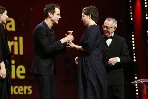 Tom Tykwer L awards Adina Pintilie the Golden Bear for the Best Film right next to it the Berlinale Chef Dieter Kosslick on the stage of the award ceremony on 24 02 2018 in Berlin in the Berlinale Palast Tom Tykwer L awards Adina Pintilie the Golden Bear for the Best Film right next to it Berlinale boss Dieter Kosslick on the stage of the award ceremony on 24 02 2018 in Berlin in the Berlinale Palast