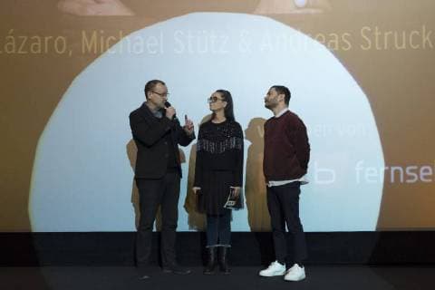 Presenter Knut Elstermann with Paz Lazaro and Michael Stütz Panorama section during the awarding of the Panorama Audience Award on the occasion of the 68th Berlin International Film Festival 68 Berlin International Film Festival