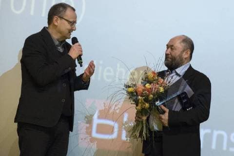 Presenter Knut Elstermann and director Timur Bekmambetov with the Panorama Audience Award for the film PROFILE during the awarding of the Panorama Audience Award on the occasion of the 68th Berlin International Film Festival 68 Berlin International Film Festival