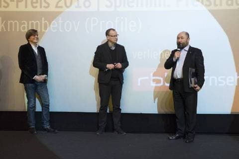 Dr Jan Schulte Kellingahus Program Director rbb Moderator Knut Elstermann and director Timur Bekmambetov with the Panorama Audience Award for the film PROFILE during the 68th Berlin International Film Festival 68 Berlin International Film Festival