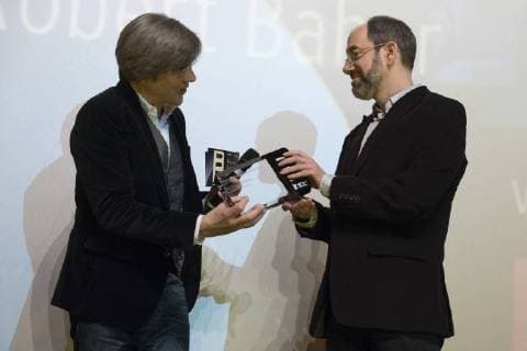 Dr Jan Schulte Kellinghaus Program Director rbb presents director Robert Bahar with the Panorama Audience Award for the film THE SILENCE OF OTHERS during the 68th Berlin International Film Festival 68 Berlin International Film Festival